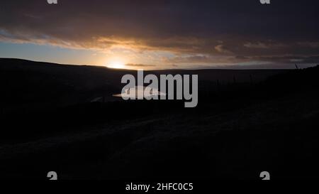 Dawn light on Butterley Reservoir & Wessenden Valley from near the junction of the old pack horse track & the Hades farm track, Pule, Marsden. Stock Photo