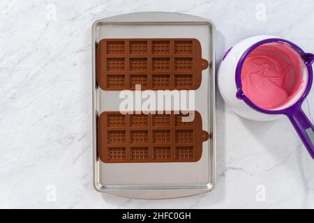 Mini pink chocolates Stock Photo - Alamy