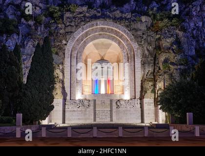 The Rauba Capeu War Memorial set into the quarry cliffs on Castle Hill in Nice France, honouring local citizens killed in WW 1, is illuminated at nigh Stock Photo