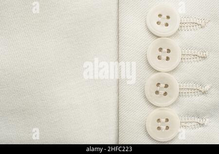 Buttons on white clothes. Element of men's clothing. Sleeve with buttons men's suit Stock Photo