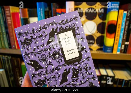 Porto, Portugal - 18th November 2019: A Christmas Carol by famous author Charles Dickens. Vintage classics books in a bookstore, traditional Christmas Stock Photo