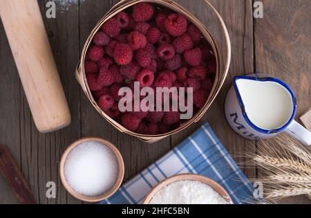 Kitchen background, cooking, Strawberry cherry pie recipe. Eggs, flour, sugar, strawberries and honey, top view, flat lay. Bakery background, modern Stock Photo
