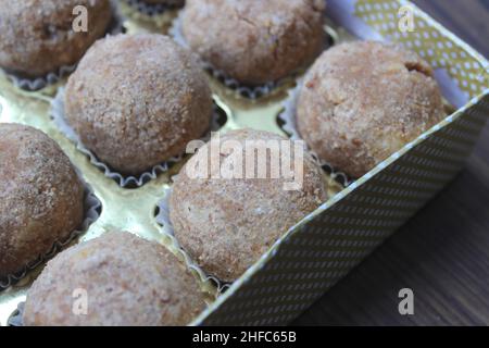 Delicious atta laddoo inside a box closeup Stock Photo