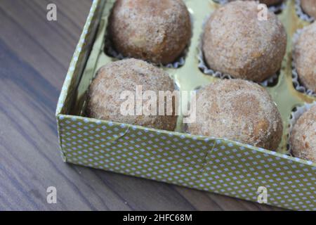 Delicious atta laddoo inside a box closeup Stock Photo