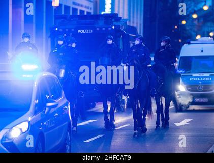 Frankfurt, Germany. 15th Jan, 2022. 15 January 2022, Hessen, Frankfurt/Main: Opponents of the current Corona measures demonstrate in downtown Frankfurt am Main. The police accompanied the action with a massive force also on horseback. Photo: Boris Roessler/dpa Credit: dpa picture alliance/Alamy Live News Stock Photo