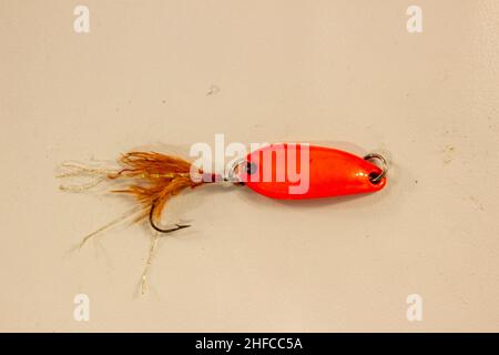 Fake Bait For Fishing,Orange Rubber Worm On The Hands Of Fishermen