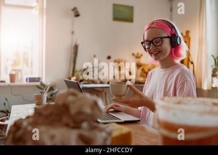 Young female works for craft handmade crockery business in workshop Stock Photo