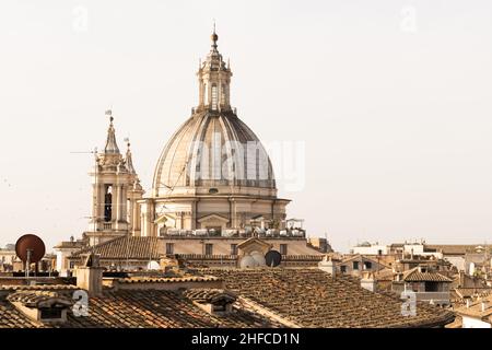View of the tiled roofs and dome of the cathedral in Italy, Roma.