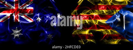 Flags of Australia, Australian vs Catalonia, Catalan, Catalonian, Spain. Smoke flag placed side by side on black background. Stock Photo