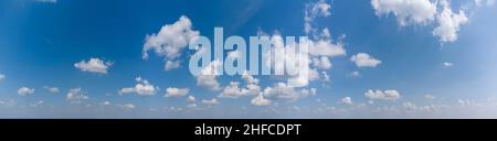 White loose clouds on a blue sky Stock Photo