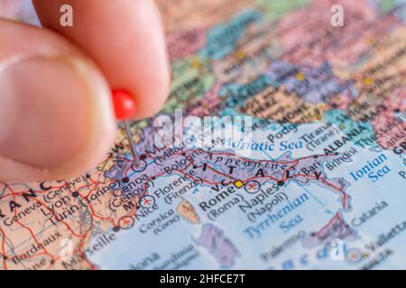 Italy pin on a world map. Italy travel destination planning pinned Stock Photo