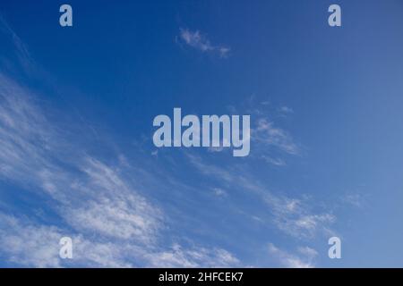 White clouds on a blue sky. Clear day. Stock Photo