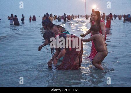 January 14, 2022, South 24 parganas, West Bengal, India: All pilgrims and Sadhus are enjoyed for took Holy Bath on Makar Sankranti Punyatithi. Makar Sankranti or Uttarayan or Maghi or simply Sankranti, also known in Bangladesh and West Bengal as Poush Sankranti, and in Nepal as Maghe Sankranti, sankranti here means ''˜transfer', this day is considered as the transition day of Sun into the Capricorn. Now the sun moves northwards in the Hindu calendar, dedicated to the deity Surya (sun), many native festivals are organised all over India. It is observed each year the day Sun enters the Caprico Stock Photo