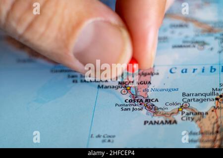 Costa Rica pin on a world map. Costa Rica travel destination planning Stock Photo
