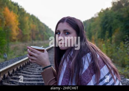beautiful girl on the railway track. Stock Photo