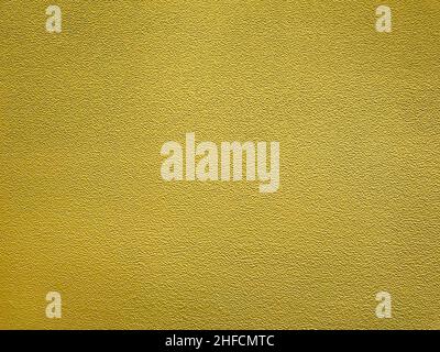 Yellow coloured abstract background, plastered surface of the city wall. Stock Photo