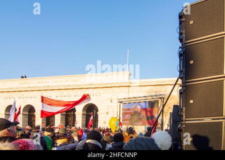 Wien, Vienna: Herbert Kickl, Chairman of the Freedom Party of Austria (FPÖ), speaks (broadcast on a screen) to demonstrators at a rally to protest aga Stock Photo