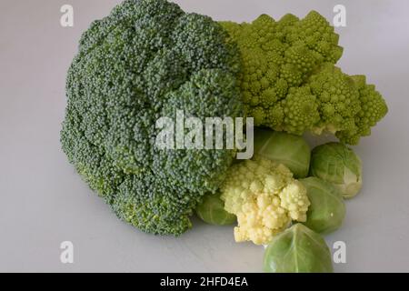 romanescu, broccoli and brussels sprouts together on white background Stock Photo