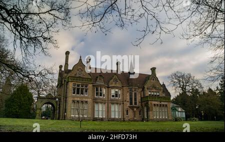 Denzell House, nestled in the beautiful surroundings of the Denzell Gardens (Devisdale) on an early winter morning with blue sky. Stock Photo