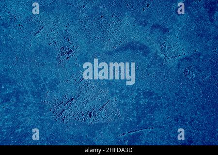 Abstract deep blue background. Detailed plastering texture wall colored in blue. Painted wall. Stock Photo