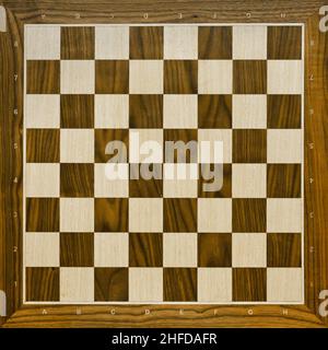 Top view on wooden chess board. Chess game. Stock Photo