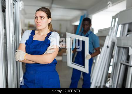 Portrait of sad woman worker who is standing Stock Photo