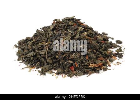 Pile of dry green gunpowder tea.  Heap of green tea leaves with safflower flower petals. Stock Photo