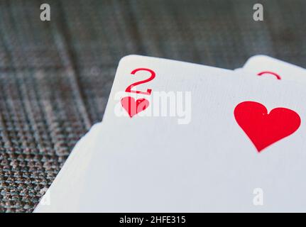 Berlin, Germany. 13th Jan, 2022. ILLUSTRATION - The two of hearts of a deck of cards lies on top of a deck of cards. This February, there are several days that lend themselves to a special wedding date, including the liquor number dates, which are 2.2.22 and 22.2.22. Credit: Annette Riedl/dpa/Alamy Live News Stock Photo