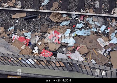 A portion of the thousands of empty boxes left by cargo thieves are seen next to a derailed Union Pacific freight train left by cargo thieves in the Lincoln Heights section of Los Angeles on Saturday, January 15, 2022. Dozens of freight cars are broken into every day on Los Angeles railways by thieves who take advantage of the train's stops to loot packages bought online leaving thousands of gutted boxes, including Amazon packages, UPS boxes, unused COVID tests, fishing lures and epi pens that will never reach their location. UPS bags are popular among 'thieves opening cargo containers' becaus Stock Photo