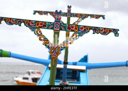Close-up view showing the carved and painted detail of a perhau boat at Tuban Beach, Bali in Indonesia. Stock Photo