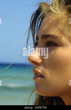 Close-up of profil smiling blond woman lying in water Stock Photo - Alamy