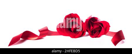 Two heart shaped red roses and ribbons isolated on white background, Valentines day Stock Photo