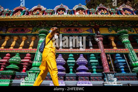 Kuala Lumpur, Malaysia. 16th Jan, 2022. A Hindu devotee carries a pot of milk on the head as he walks up to the Batu Caves Temple ahead of the festival celebrations.Thaipusam is a Hindu festival celebrated mostly by the Tamil community. Devotees will pray and make vows when the prayers are answered. Strict SOPs will be in force for this year's Thaipusam celebration which falls on January 18, due to the pandemic of Covid-19. (Photo by Wong Fok Loy/SOPA Images/Sipa USA) Credit: Sipa USA/Alamy Live News Stock Photo