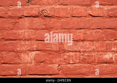 red brick wall gives a harmonic pattern in the sun Stock Photo