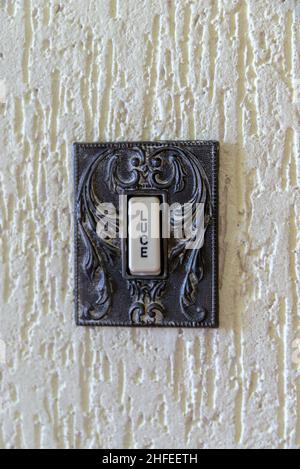 Old-fashioned, Art Nouveau style Italian light switch Stock Photo