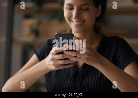 Close up young woman using cellphone application. Stock Photo