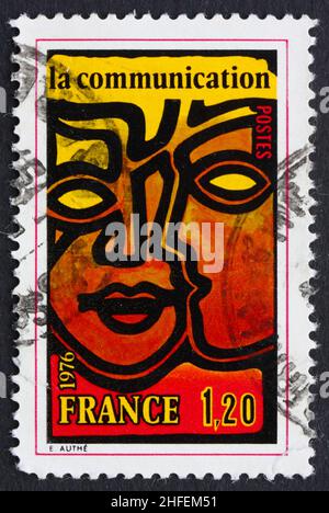 FRANCE - CIRCA 1976: a stamp printed in the France shows Two Faces, Communication, circa 1976 Stock Photo