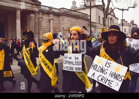 London, UK 15th January 2022. Kill The Bill protesters hold hands in Whitehall. Thousands of people marched through central London in protest against the Police, Crime, Sentencing and Courts Bill, which will make many types of protest illegal. Stock Photo