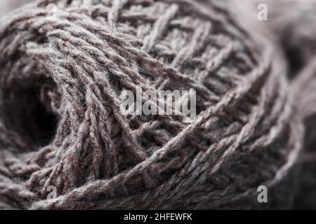 Light brown wool yarn made of threads in tangles. Needlework Stock Photo