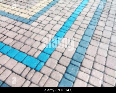 Abstract blurred background decorative paving slabs viewed at a slight angle Stock Photo