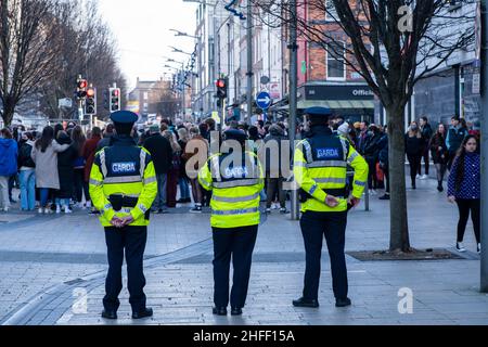 Limerick, Ireland-January, 15, 2022.Meeting of people on Bedford Row street, protected by Garda Stock Photo