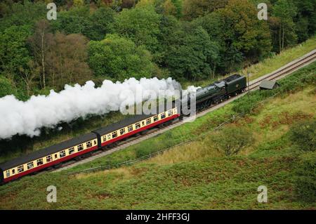 Running tender first, BR Standard Pacific No 71000 Duke of Gloucester leaves a smoke trail through Newtondale, North Yorkshire. 28.09.2008. Stock Photo