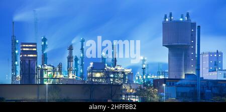 Detail of a chemical industry plant in blue colors by night Stock Photo