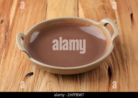 Handmade Brown Ceramic Plate with Handle on Wooden Table, Selective Focus Stock Photo
