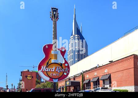 Nashville, TN, USA - September 21, 2019:  The Hard Rock Café and its iconic guitar and the Batman Building in the background. Stock Photo