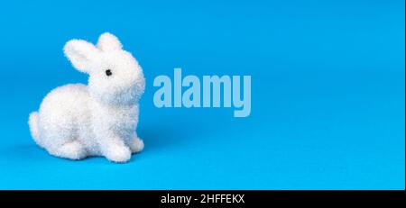 Easter bunny on bright blur background, banner design, postcard or greetings concept, copy space Stock Photo