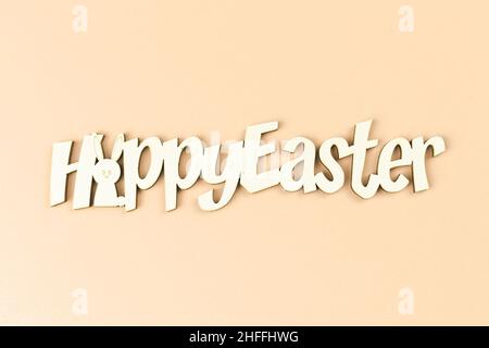 Happy easter text on a bright background, greeting concept, top view and flat lat concept Stock Photo
