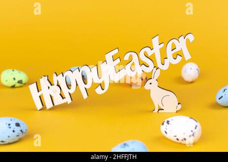 Happy easter text, greeting card background. Spring holiday decorations and colorful eggs, copy space Stock Photo