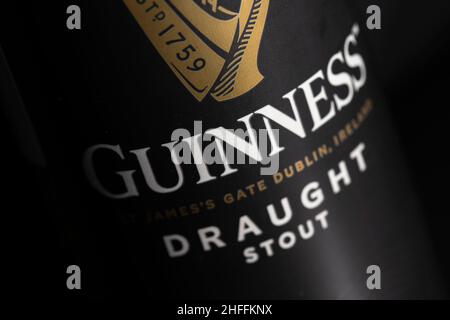 Guinness draught stout can close up detail on black Stock Photo