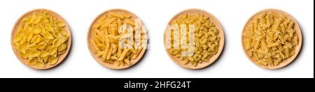 variety of uncooked pasta on a wooden plate, isolated on white background, diet and food concept, collection Stock Photo